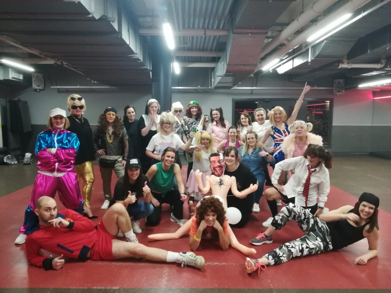 Bride and friends celebrating with What a Feeling routine at Flashdance hen party Glasgow